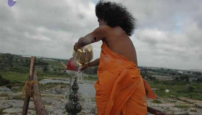 Energized waters from the homa poured over gopuram by sph