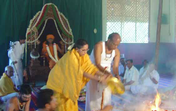 The representatives of Sathya Sai Baba performing